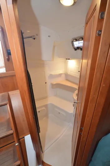 Tahlequah Yacht Photos Pics 2020 Tartan 365 yacht interior bathroom with wooden accents and compact design.