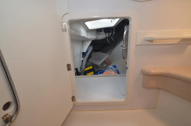 Tahlequah Yacht Photos Pics Storage compartment inside a 2020 Tartan 365 yacht, containing tools and equipment.