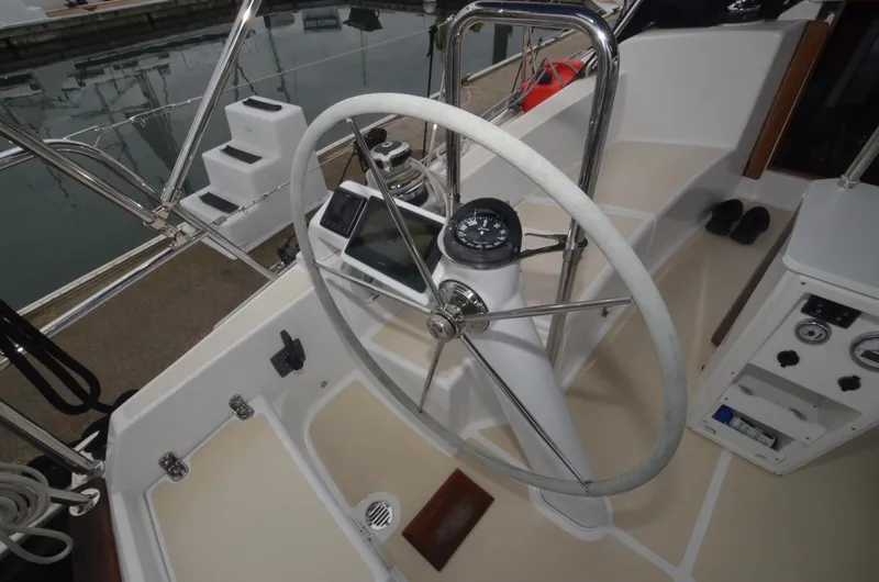 Tahlequah Yacht Photos Pics Steering wheel and controls of a 2020 Tartan 365 sailboat in a marina setting.
