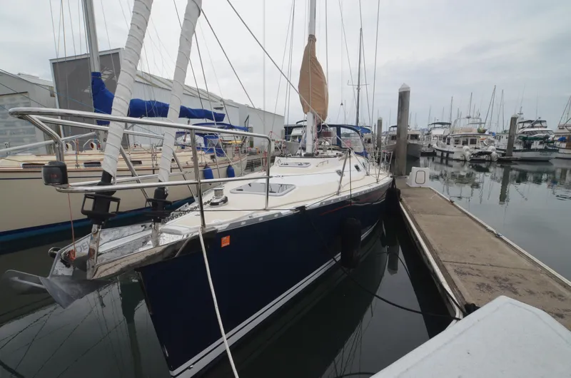 Tahlequah Yacht Photos Pics Sailboat docked at marina, Tartan 365 model, 2020, with blue hull and white deck.