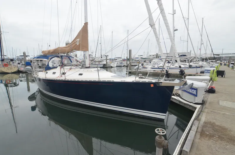 Tahlequah Yacht Photos Pics Sailboat Tartan 365, 2020 model, docked at marina with other boats in background.
