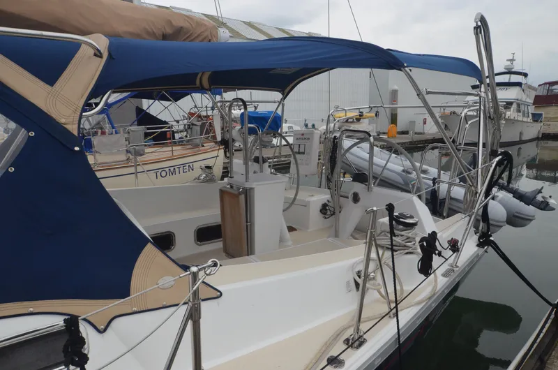 Tahlequah Yacht Photos Pics Tartan 365 sailboat, 2020 model, docked with blue canopy and visible cockpit area.