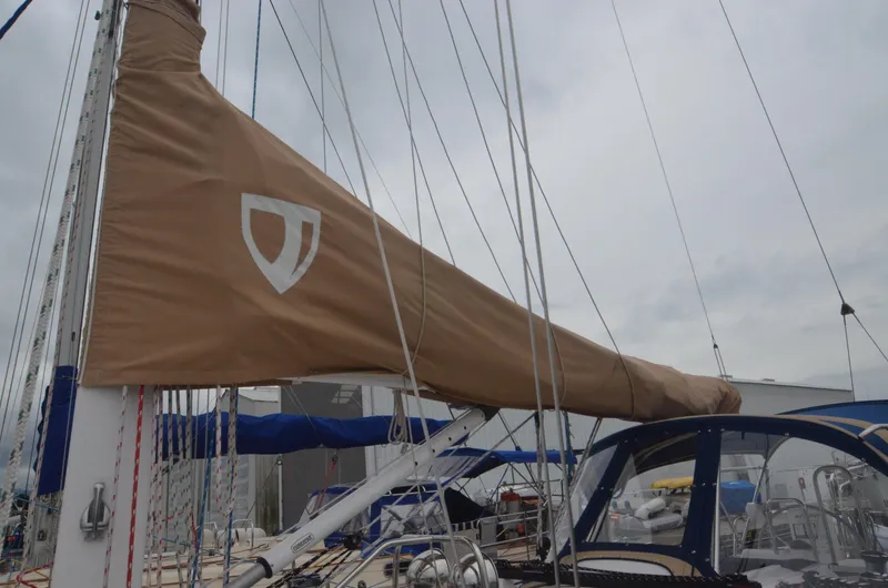 Tahlequah Yacht Photos Pics 2020 Tartan 365 sailboat with tan sail cover and blue cockpit canopy.
