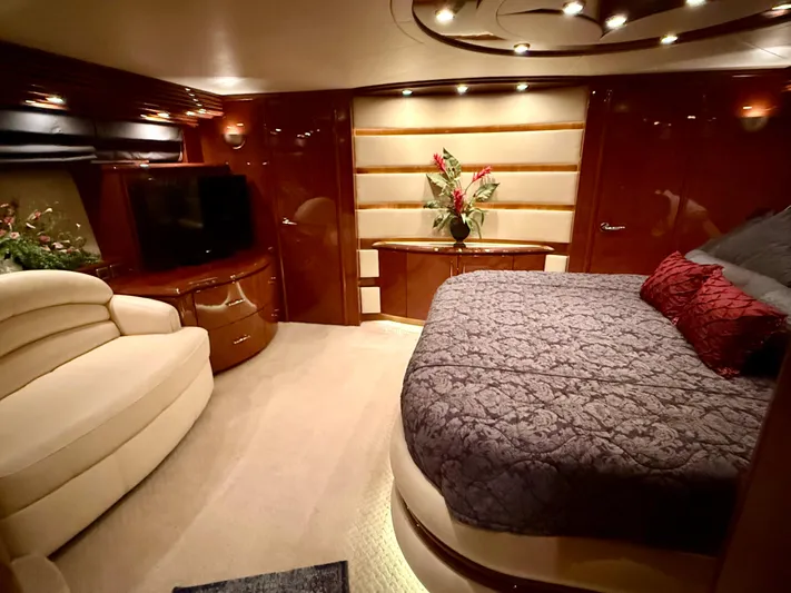 Tenacity Yacht Photos Pics Luxurious interior of a 2005 Marquis 65 yacht with elegant bedroom decor.
