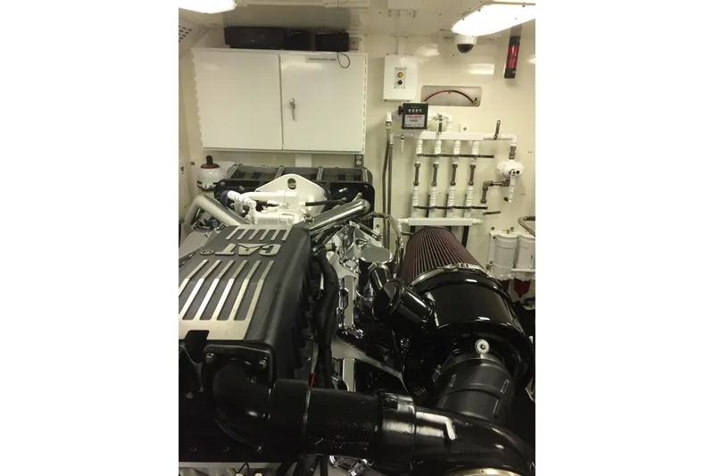 Front Row Yacht Photos Pics Engine room of 2006 NorthCoast PILOTHOUSE with CAT engine and filtration system.