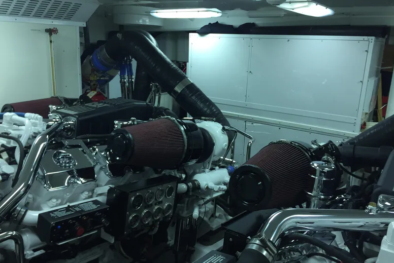 Front Row Yacht Photos Pics Engine room of 2006 NorthCoast PILOTHOUSE yacht with visible air filters and piping.