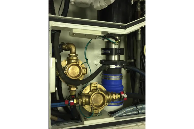 Front Row Yacht Photos Pics Engine compartment of 2006 NorthCoast PILOTHOUSE with brass pumps and hoses.