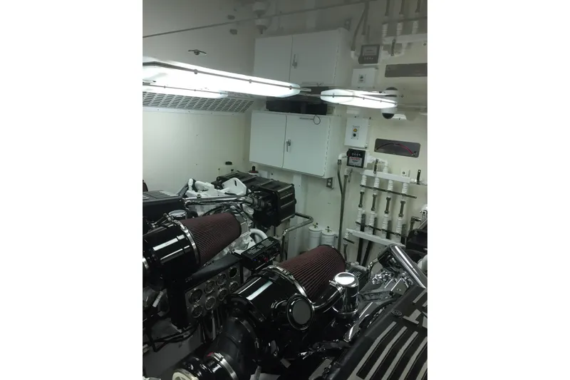 Front Row Yacht Photos Pics Engine room of 2006 NorthCoast PILOTHOUSE yacht with visible machinery and control panels.