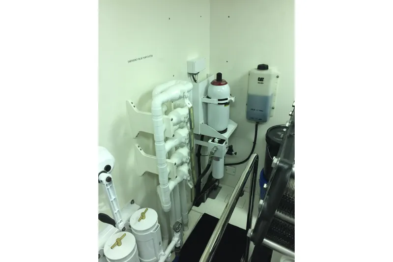 Front Row Yacht Photos Pics Engine room of 2006 NorthCoast PILOTHOUSE with pipes and equipment.