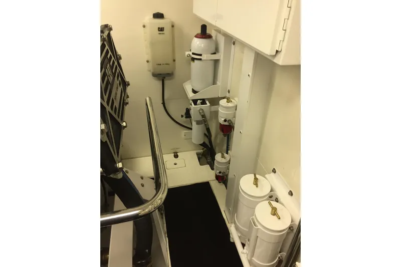 Front Row Yacht Photos Pics Engine room of 2006 NorthCoast PILOTHOUSE with fuel filters and CAT equipment.