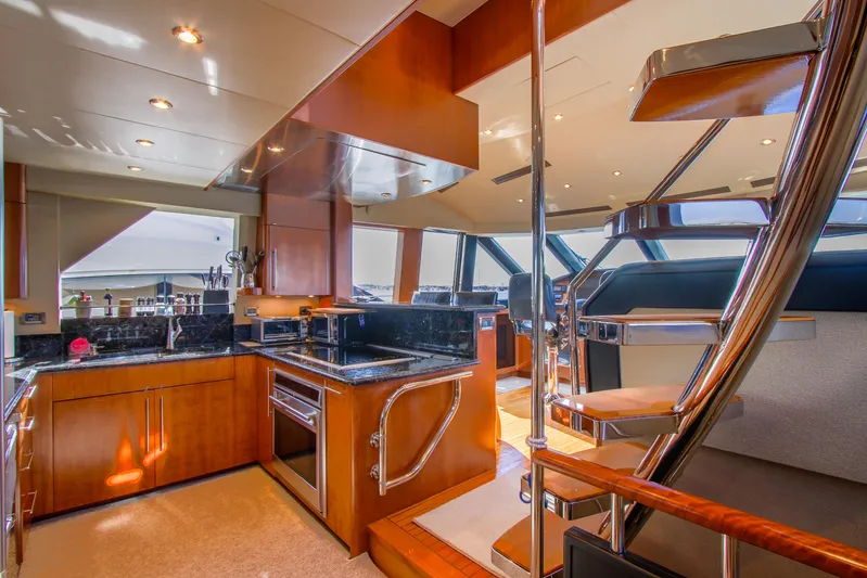 Front Row Yacht Photos Pics Luxurious 2006 Northcoast Yachts Yachtfisher interior with modern kitchen and elegant staircase.