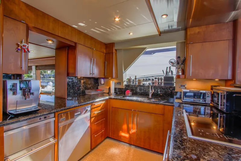 Front Row Yacht Photos Pics Luxurious kitchen interior of 2006 Northcoast Yachts Yachtfisher with modern appliances and wood cabinetry.