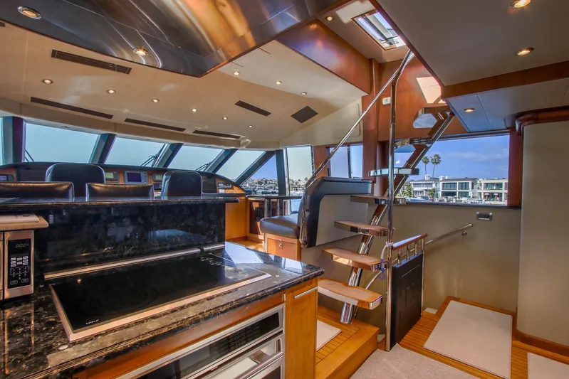 Front Row Yacht Photos Pics Luxurious 2006 Northcoast Yachts Yachtfisher interior with modern kitchen and elegant staircase.