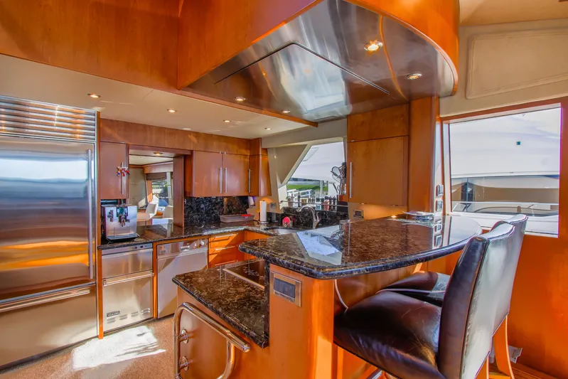 Front Row Yacht Photos Pics Luxurious 2006 Northcoast Yachts Yachtfisher kitchen with modern appliances and elegant wood finishes.