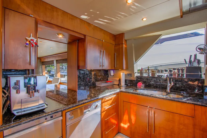 Front Row Yacht Photos Pics Luxurious kitchen interior on 2006 Northcoast Yachts Yachtfisher with modern appliances and wood cabinetry.