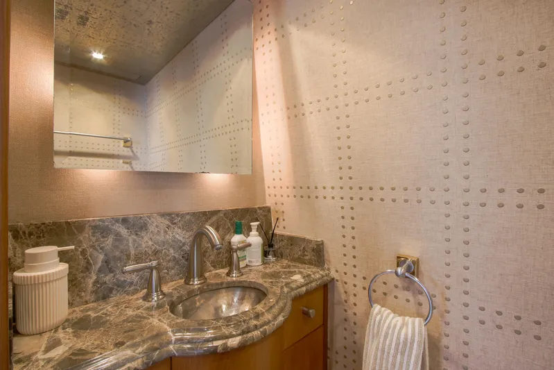 Front Row Yacht Photos Pics Luxurious bathroom in 2006 Northcoast Yachts Yachtfisher with marble countertop and modern fixtures.