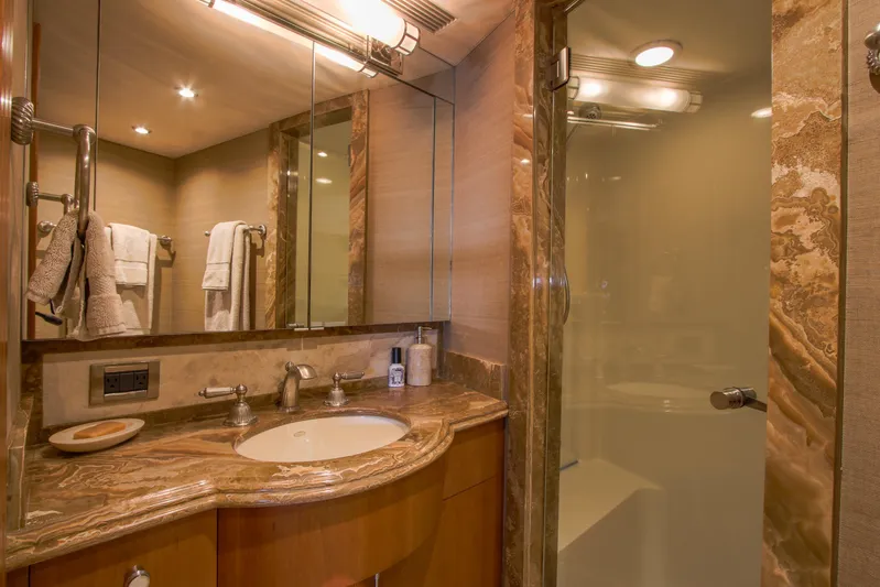Front Row Yacht Photos Pics Luxurious bathroom in 2006 Northcoast Yachts Yachtfisher with marble countertop and glass shower.