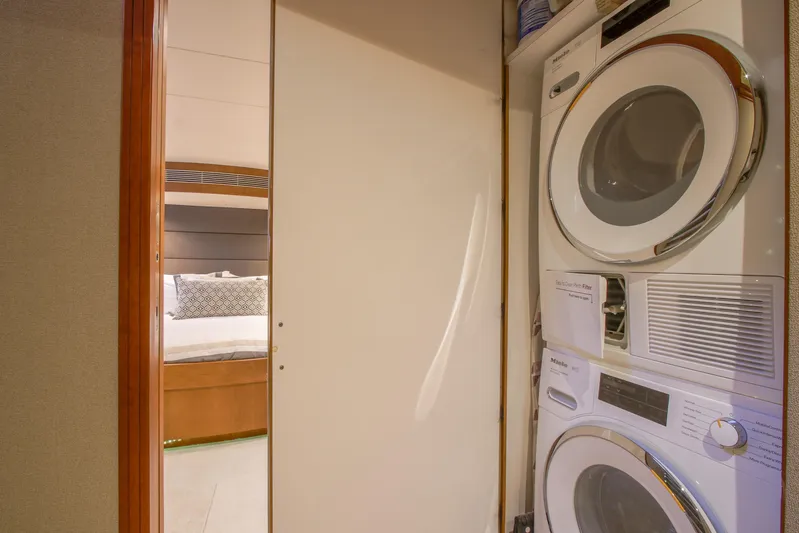 Front Row Yacht Photos Pics Laundry area in 2006 Northcoast Yachts Yachtfisher, featuring modern washer and dryer.