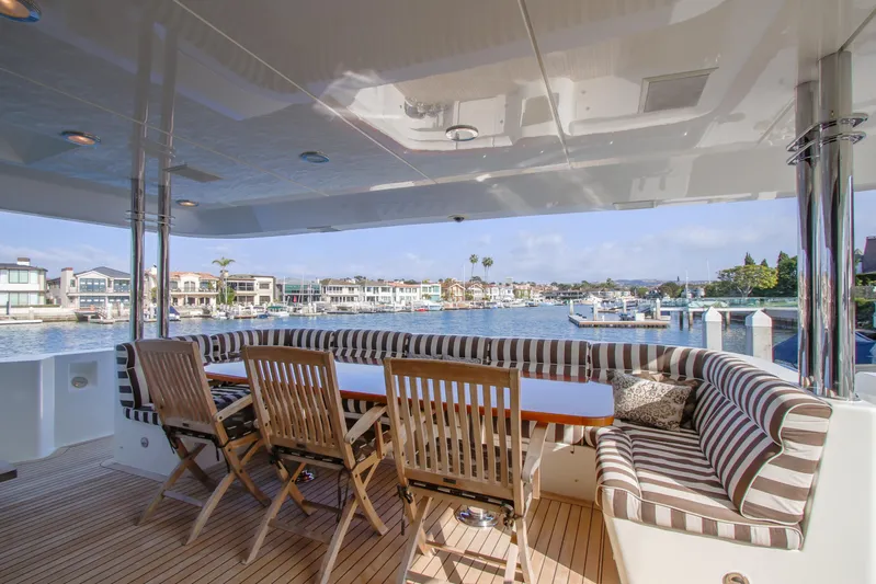 Front Row Yacht Photos Pics Luxurious 2006 Northcoast Yachts Yachtfisher with elegant seating and scenic waterfront view.