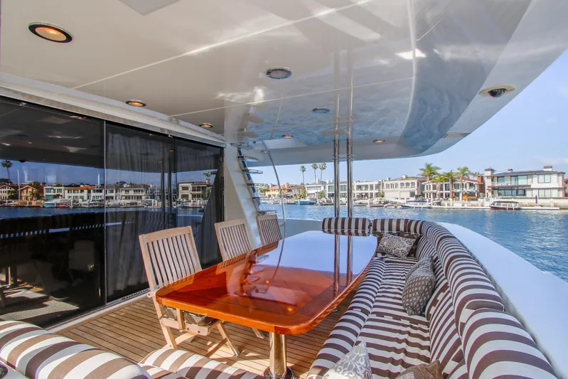 Front Row Yacht Photos Pics Luxurious 2006 Northcoast Yachts Yachtfisher with elegant outdoor dining area and waterfront view.