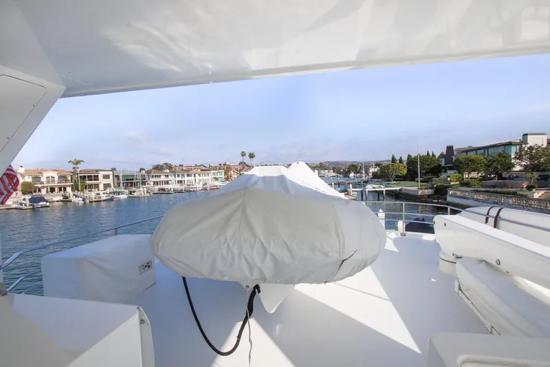 Front Row Yacht Photos Pics 2006 Northcoast Yachts Yachtfisher deck view with marina and waterfront homes.