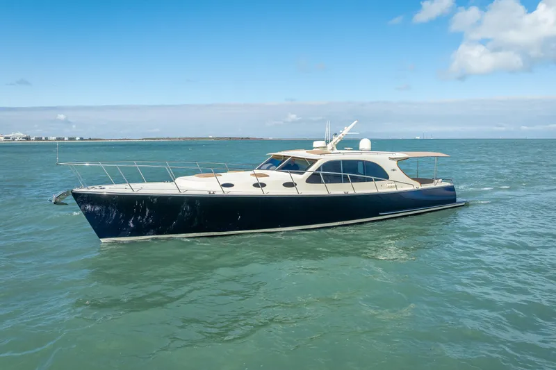 Stella Yacht Photos Pics 2018 Palm Beach Motor Yachts PB50 cruising on open water under blue skies.