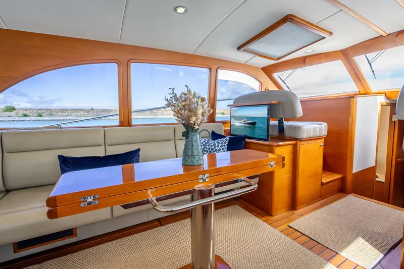 Stella Yacht Photos Pics Luxurious interior of 2018 Palm Beach Motor Yachts PB50 with elegant wood finishes.