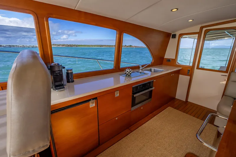 Stella Yacht Photos Pics Luxurious interior of 2018 Palm Beach Motor Yachts PB50 with ocean view.