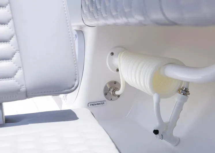  Yacht Photos Pics 2025 Invincible 43 Open Fisherman freshwater hose detail with white seating.