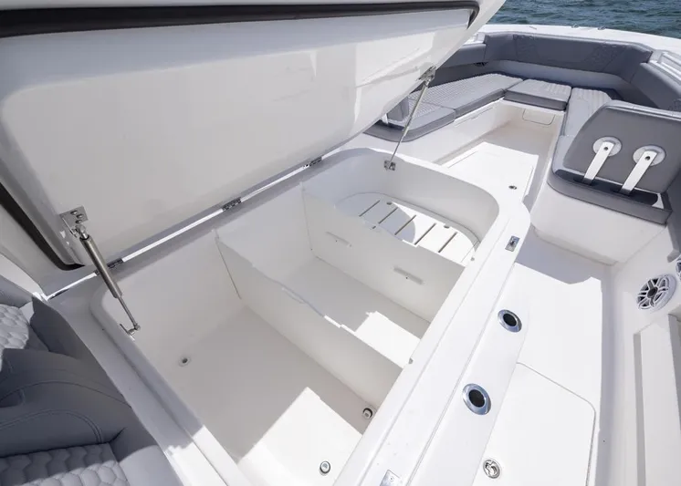  Yacht Photos Pics 2025 Invincible 43 Open Fisherman boat with open storage compartment and seating area.