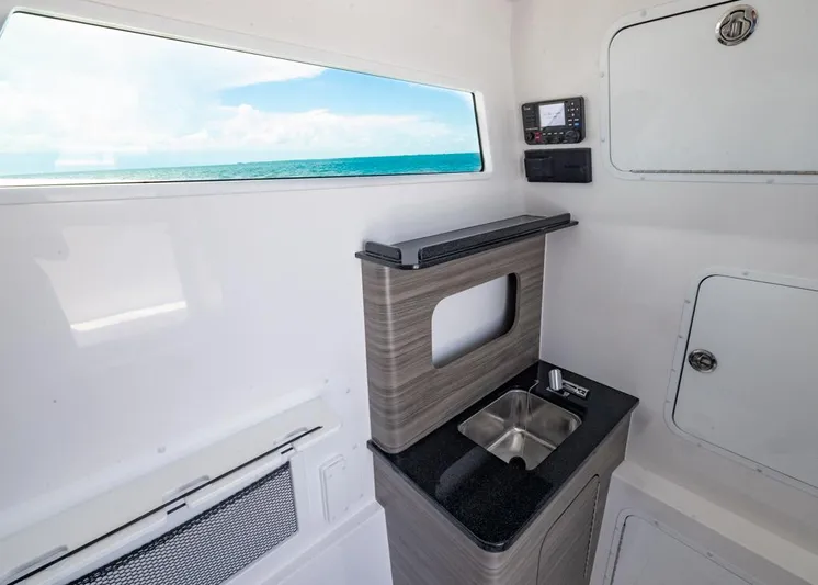  Yacht Photos Pics Interior of 2025 Invincible 43 Open Fisherman boat with sink and ocean view.