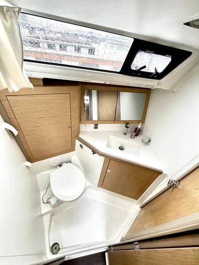  Yacht Photos Pics 2018 Beneteau Oceanis 45 yacht bathroom with modern fixtures and wood accents.