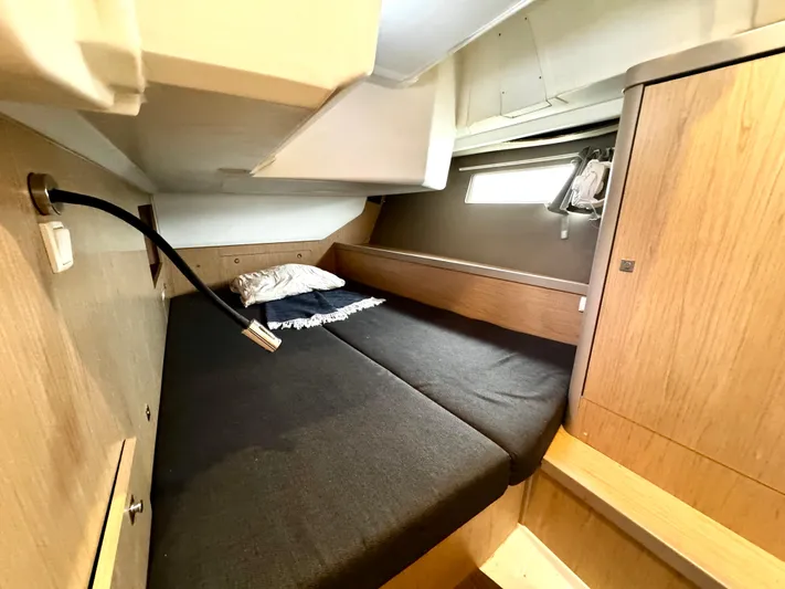  Yacht Photos Pics Cozy cabin interior of 2018 Beneteau Oceanis 45 yacht with wooden finish.