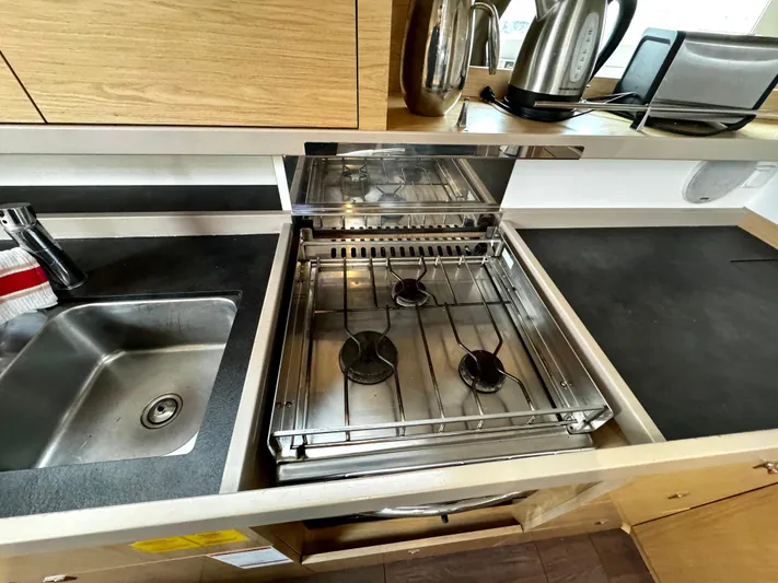  Yacht Photos Pics Modern kitchen in 2018 Beneteau Oceanis 45 yacht with stove and sink.