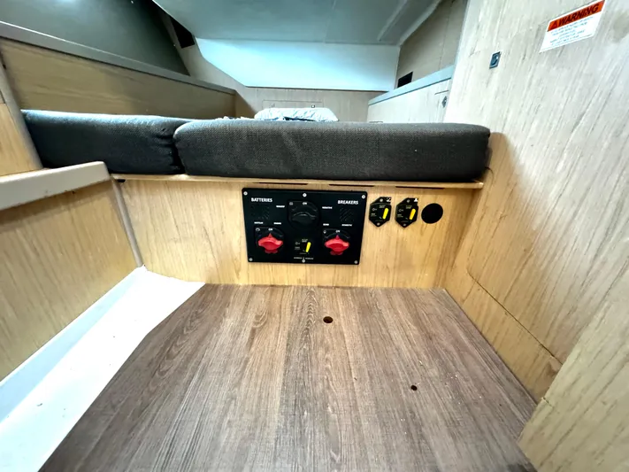  Yacht Photos Pics Interior of 2018 Beneteau Oceanis 45 yacht showing control panel and seating area.