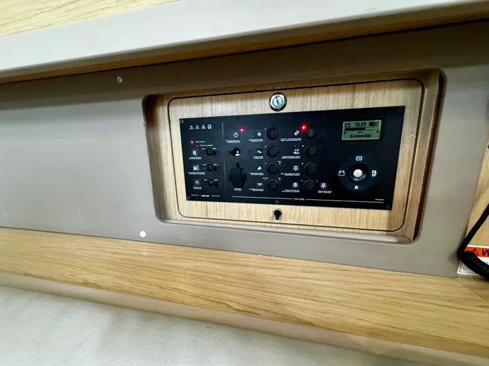  Yacht Photos Pics Control panel on 2018 Beneteau Oceanis 45 yacht, featuring various switches and indicators.
