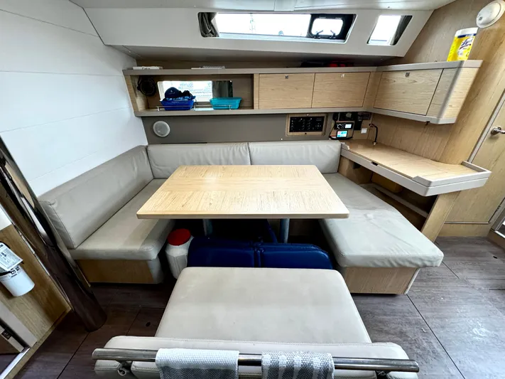  Yacht Photos Pics Interior of 2018 Beneteau Oceanis 45 yacht with modern seating and dining area.