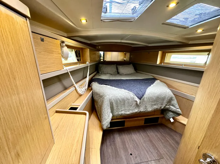  Yacht Photos Pics Luxurious cabin interior of 2018 Beneteau Oceanis 45 yacht with cozy bedding.