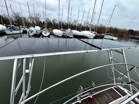 Yacht Photos Pics Beneteau Oceanis 45 (2018) with solar panels, docked in a marina.