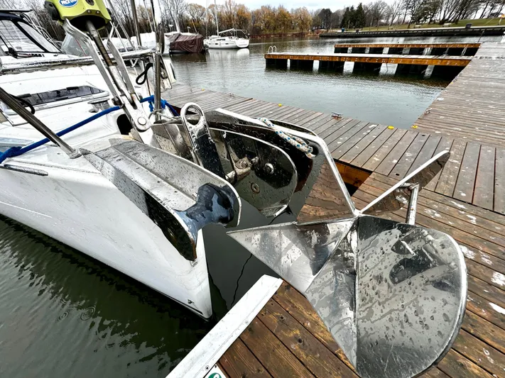  Yacht Photos Pics Beneteau Oceanis 45 (2018) yacht docked, featuring a large anchor and sleek design.