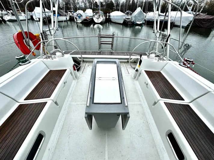  Yacht Photos Pics Beneteau Oceanis 45 (2018) yacht cockpit with seating, docked at marina.