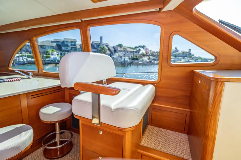 Eleven11 Yacht Photos Pics Luxurious 2018 Palm Beach Motor Yachts PB55 interior with elegant wood finish and waterfront view.