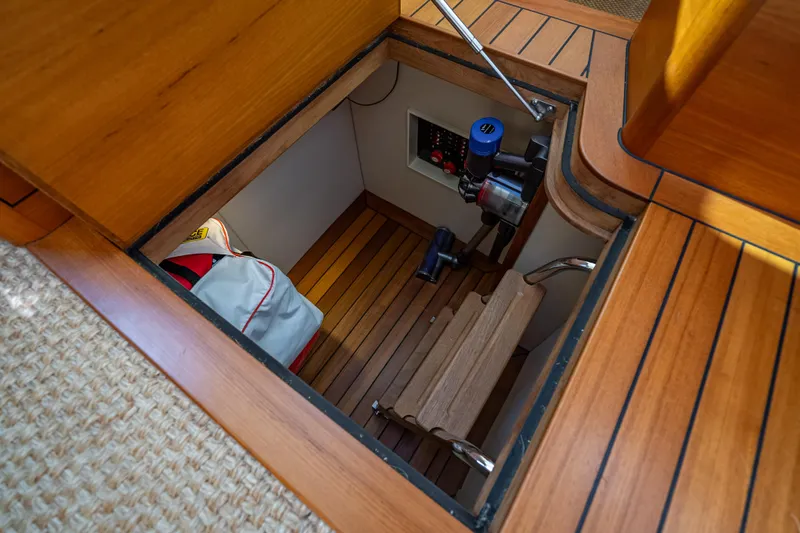 Eleven11 Yacht Photos Pics 2018 Palm Beach Motor Yachts PB55 engine room with wooden flooring and equipment.