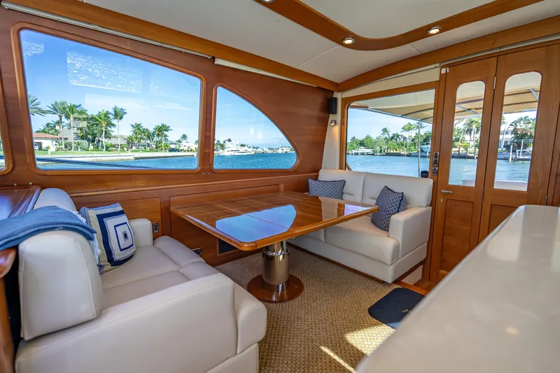 Eleven11 Yacht Photos Pics Luxurious interior of 2018 Palm Beach Motor Yachts PB55 with elegant seating and scenic views.