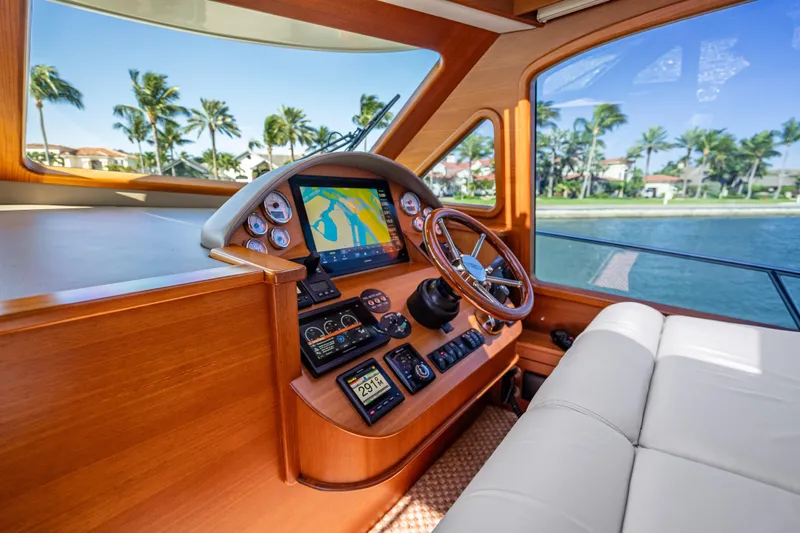 Eleven11 Yacht Photos Pics 2018 Palm Beach Motor Yachts PB55 helm with navigation display and luxurious interior.