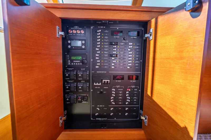 Eleven11 Yacht Photos Pics Electrical control panel inside 2018 Palm Beach Motor Yachts PB55, featuring switches and meters.