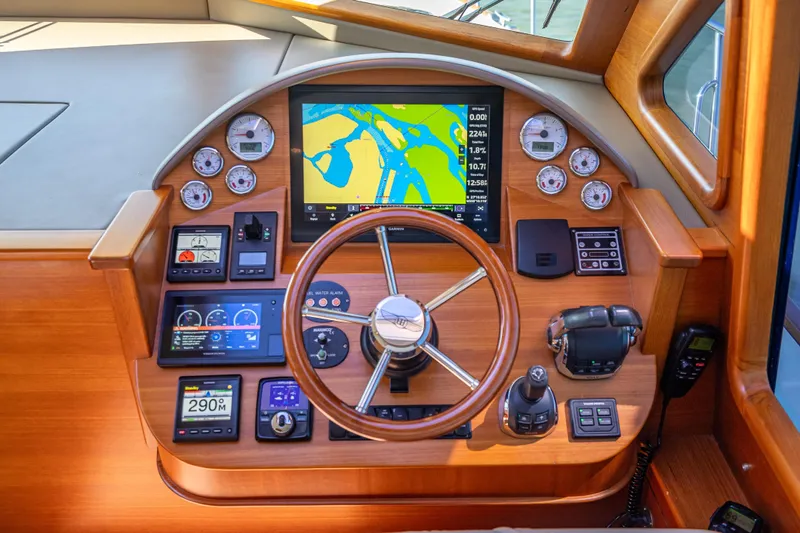 Eleven11 Yacht Photos Pics 2018 Palm Beach Motor Yachts PB55 helm with navigation display and controls.