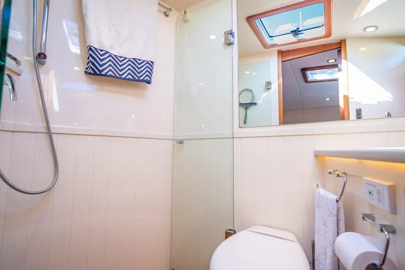 Eleven11 Yacht Photos Pics Luxurious bathroom in 2018 Palm Beach Motor Yachts PB55, featuring modern fixtures and elegant design.