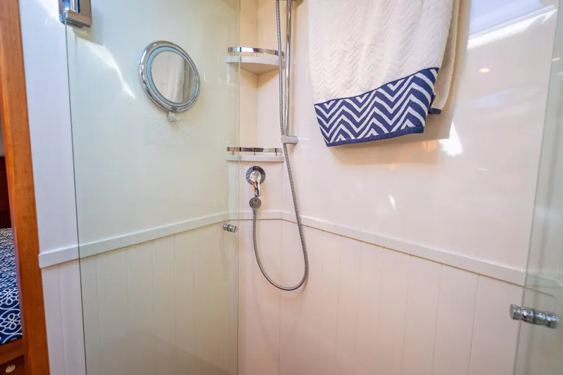 Eleven11 Yacht Photos Pics Shower area in 2018 Palm Beach Motor Yachts PB55, featuring modern fixtures and nautical decor.