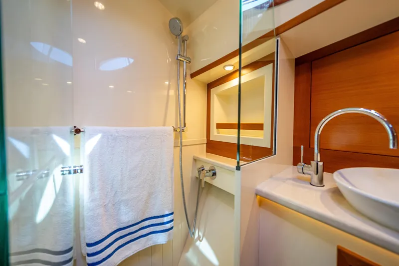 Eleven11 Yacht Photos Pics Luxurious bathroom in 2018 Palm Beach Motor Yachts PB55, featuring modern fixtures and elegant design.